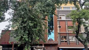 A building with a sign for the Forest Transit Hotel. - Forest Transit Hotel (Coimbatore)
