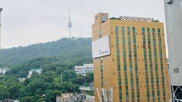 A multi-story building with a prominent billboard on the side.