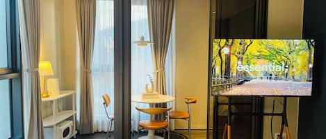 Family Twin Room, City View | Living area | TV, heated floors