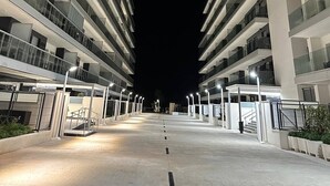 A modern multi-story building with a central courtyard. - World Magic Vacaciones 5 (Cabanes)
