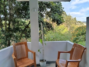 Habitación cuádruple Deluxe | Zona de estar
