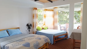 A bedroom with a bed, a fan, and a view of the outdoors. - C&D Ella (Ella)