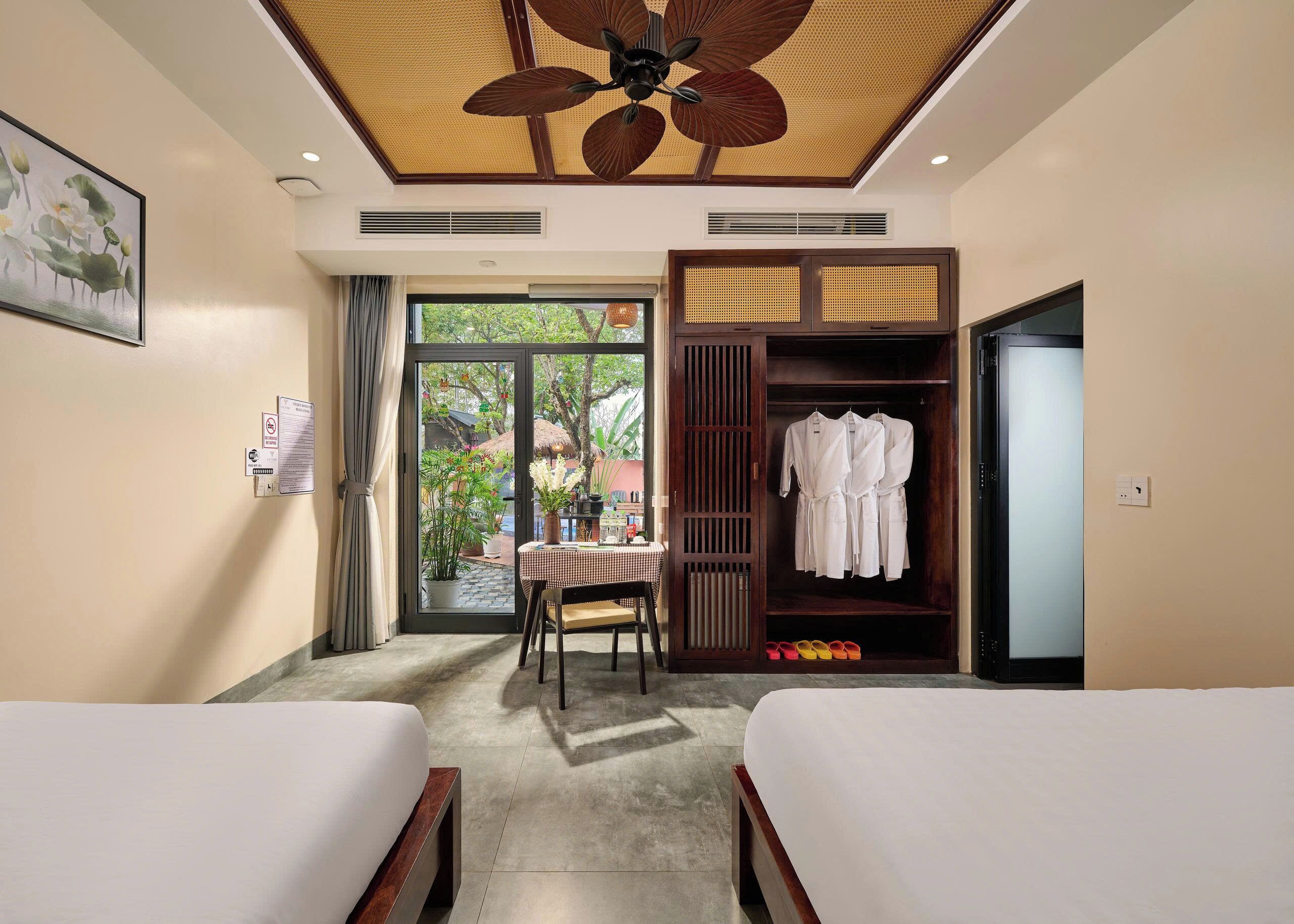 Deluxe Triple Room, Garden View | Blackout drapes, soundproofing, free WiFi, bed sheets