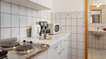 Fridge, microwave, stovetop, coffee/tea maker
