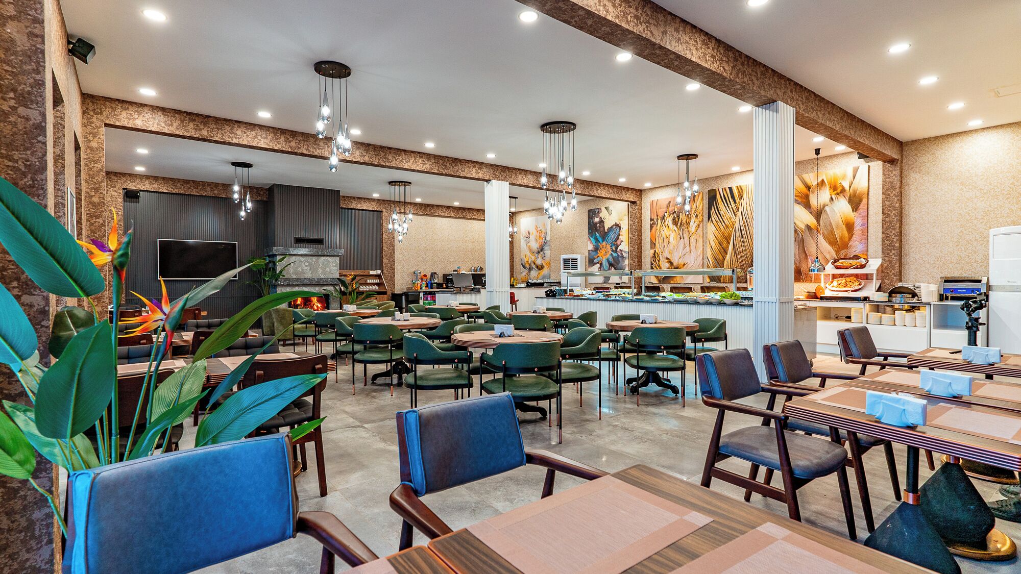 A spacious restaurant with multiple dining areas, a central fireplace, and modern lighting fixtures.