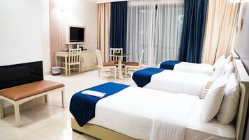 Premium bedding, desk, laptop workspace, soundproofing