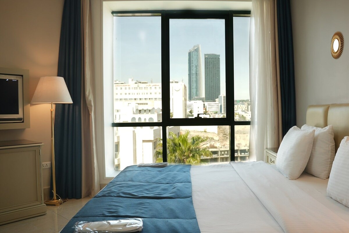 Premium bedding, desk, laptop workspace, soundproofing