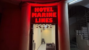 A hotel entrance with a neon sign reading "HOTEL MARINE LINES". - Hotel Marine Line (Mumbai)