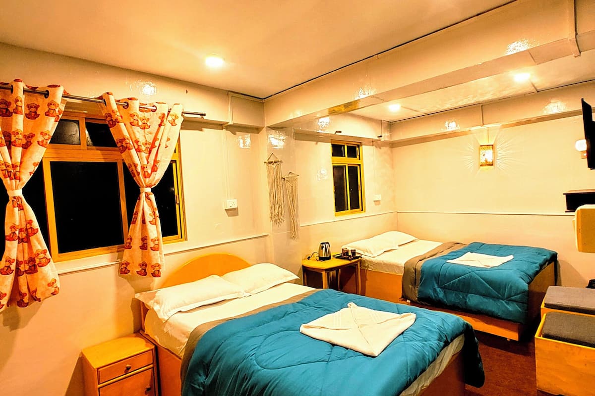 Chambre Quadruple Deluxe | Coffres-forts dans les chambres