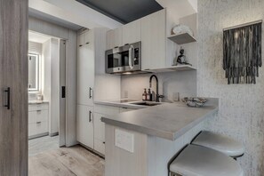 Fridge, microwave, stovetop, coffee/tea maker