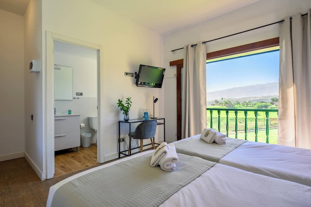 Desk, laptop workspace, free WiFi, bed sheets