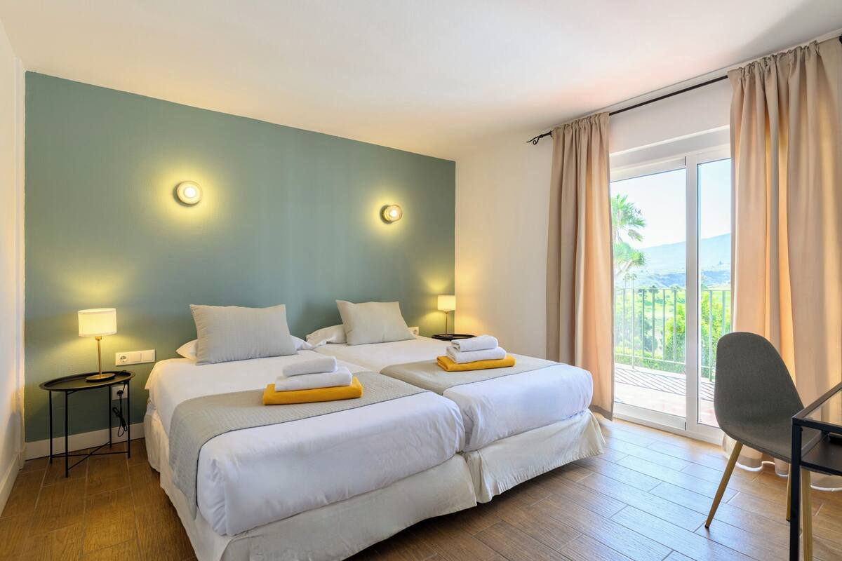 Desk, laptop workspace, free WiFi, bed sheets