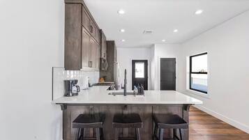 Fridge, microwave, stovetop, coffee/tea maker