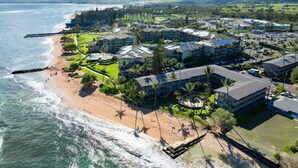 A coastal resort with beachfront properties, a golf course, and a marina. - Kailani #213, Oceanfront, Sunrise and Moon Rise Views! (Kapaa)
