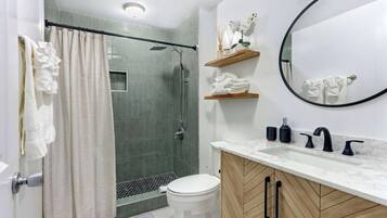 Shower, hair dryer, towels, soap