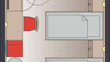 A hotel room layout with two beds, a bathroom, and a seating area.