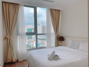 Deluxe Apartment, 2 Bedrooms, City View | Minibar, desk, laptop workspace, blackout curtains - Somi Luxstay LP (Ho Chi Minh City)