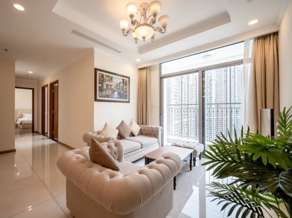 Deluxe Apartment, 3 Bedrooms, City View | Living area | LCD TV - Somi Luxstay LP (Ho Chi Minh City)