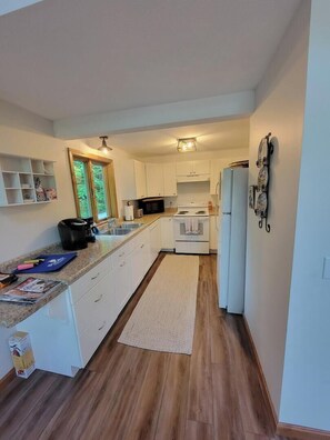 Fridge, microwave, oven, stovetop - Lake Breeze Hideaway | Lake Winnipesaukee Vacation Home in Patrician Shores (Meredith)