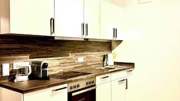 Fridge, stovetop, dishwasher, coffee/tea maker