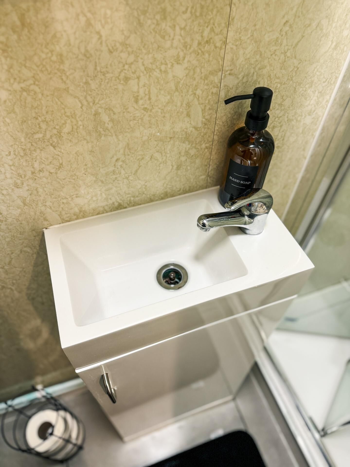 Shower, towels, soap, toilet paper