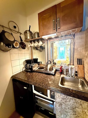 Fridge, microwave, coffee/tea maker, toaster
