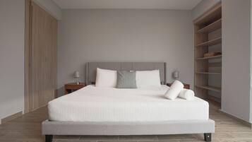Una camera da letto moderna con un letto grande, un comodino, una lampada e scaffalature integrate.