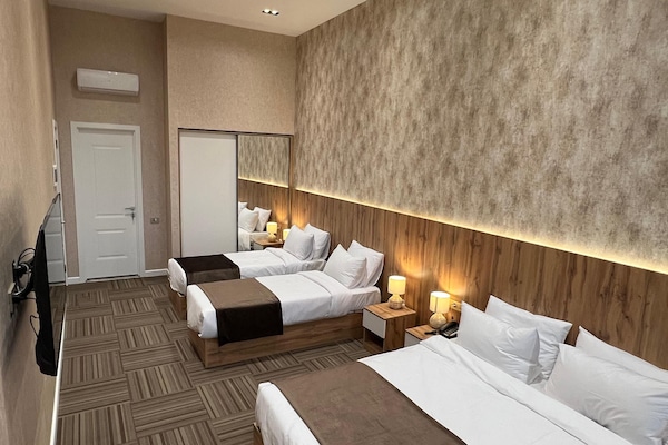 Quadruple Room, City View | In-room safe, desk, laptop workspace, free WiFi