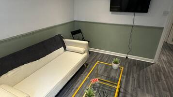 Apartment | Living area | TV, fireplace