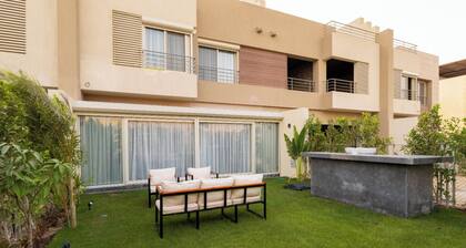 villa with private garden in the crown palm hills compound -sheikh zayed