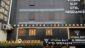 A building with a sign for 'Viyana Suit Hotel Residence' and a coffee shop named 'Viyana Coffee' on the ground floor. - Viyana Suite Hotel (Istanbul)