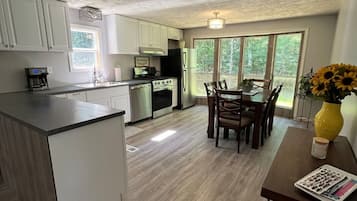 Fridge, stovetop, dishwasher, coffee/tea maker