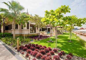 Stunning residential property with a well-manicured lawn and lush greenery.