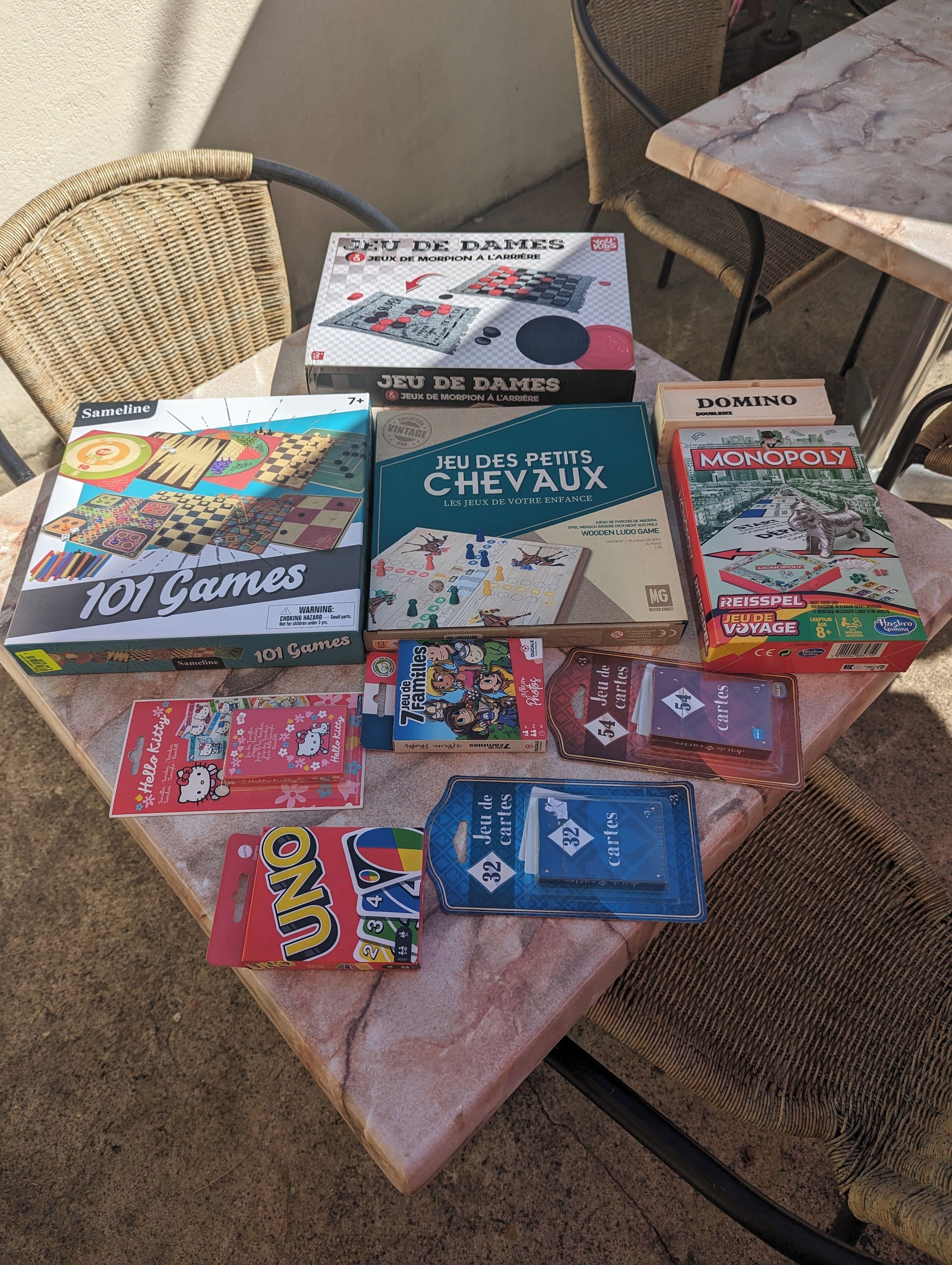 A variety of board games on a table.