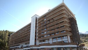 A multi-story hotel with a prominent vertical sign reading "HOTEL FRANCE".