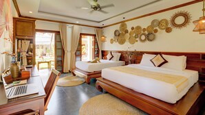 A hotel room with two beds, a desk with a laptop, and a view of the outdoors. - Elegant Boutique Hotel Luangpraban (Luang Prabang)