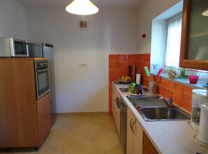 Apartment (One Bedroom Apartment with Balcony) | Private kitchen | Fridge