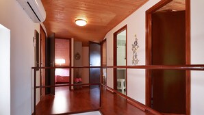 A wooden balcony with a view of a bedroom. - Sunny Holiday Home With Terrace (Lovran)