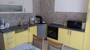 Apartment (Two Bedroom Apartment with Balcony) | Private kitchen | Fridge