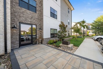 Level and well lit entrance - first floor unit.