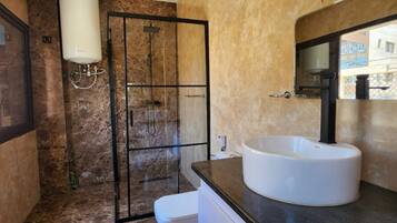 Shower, towels, soap, toilet paper