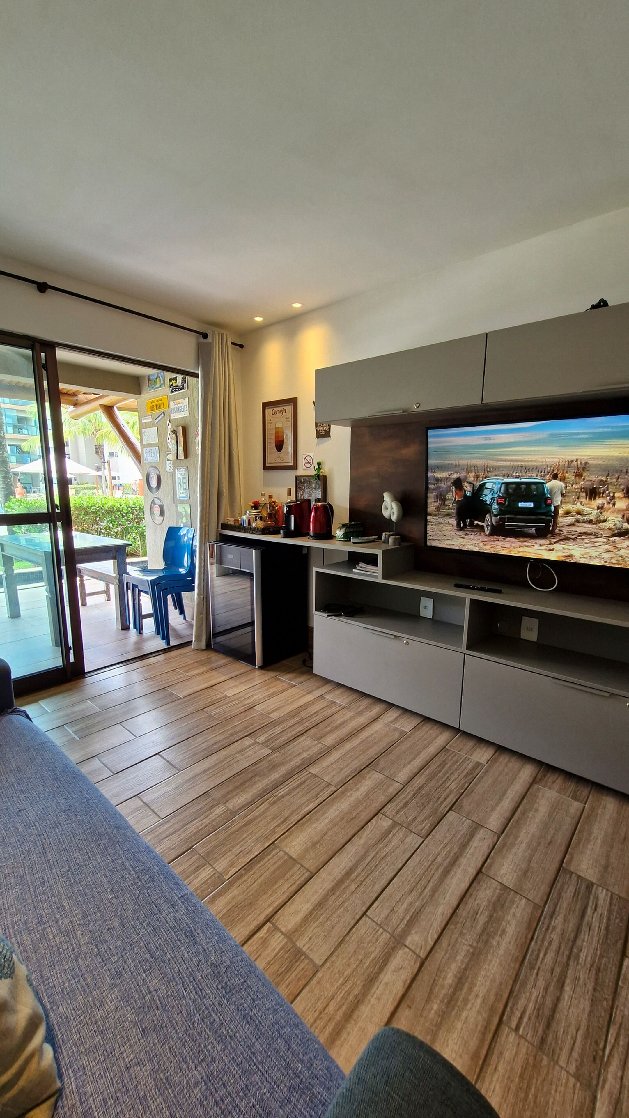 Senior Apartment | Living area | 40-inch flat-screen TV with satellite channels, TV, foosball