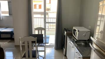 Fridge, microwave, stovetop, cookware/dishes/utensils