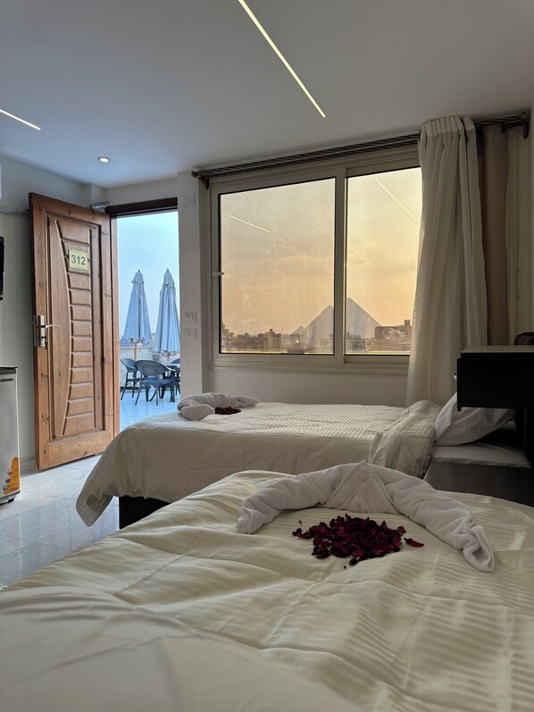 Deluxe Double Room, 2 Twin Beds, Mountain View | Free minibar, in-room safe, soundproofing, iron/ironing board - Sun 3 Pyramids Inn (Giza)