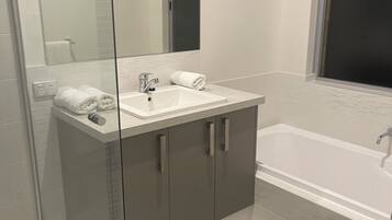 Shower, hair dryer, towels, soap