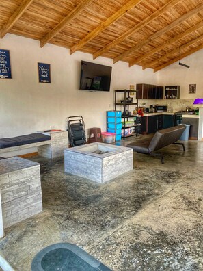 Relax in this open-plan living area with a seating area and flat-screen TV.