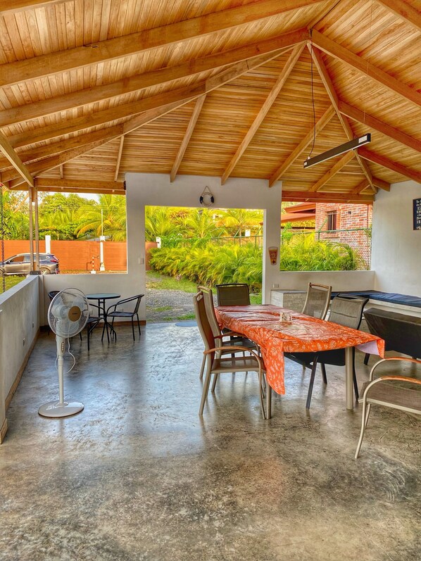 Enjoy al fresco dining and barbecues on this outdoor patio, complete with a dining table for two and a grill.