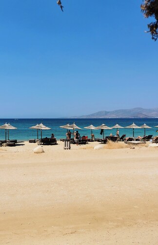 Charming Greek Apartment – Relax on the Rooftop with Sea View, 60m to the beach