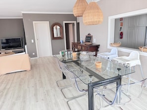 Enjoy meals in this spacious dining area with a large table and comfortable seating.