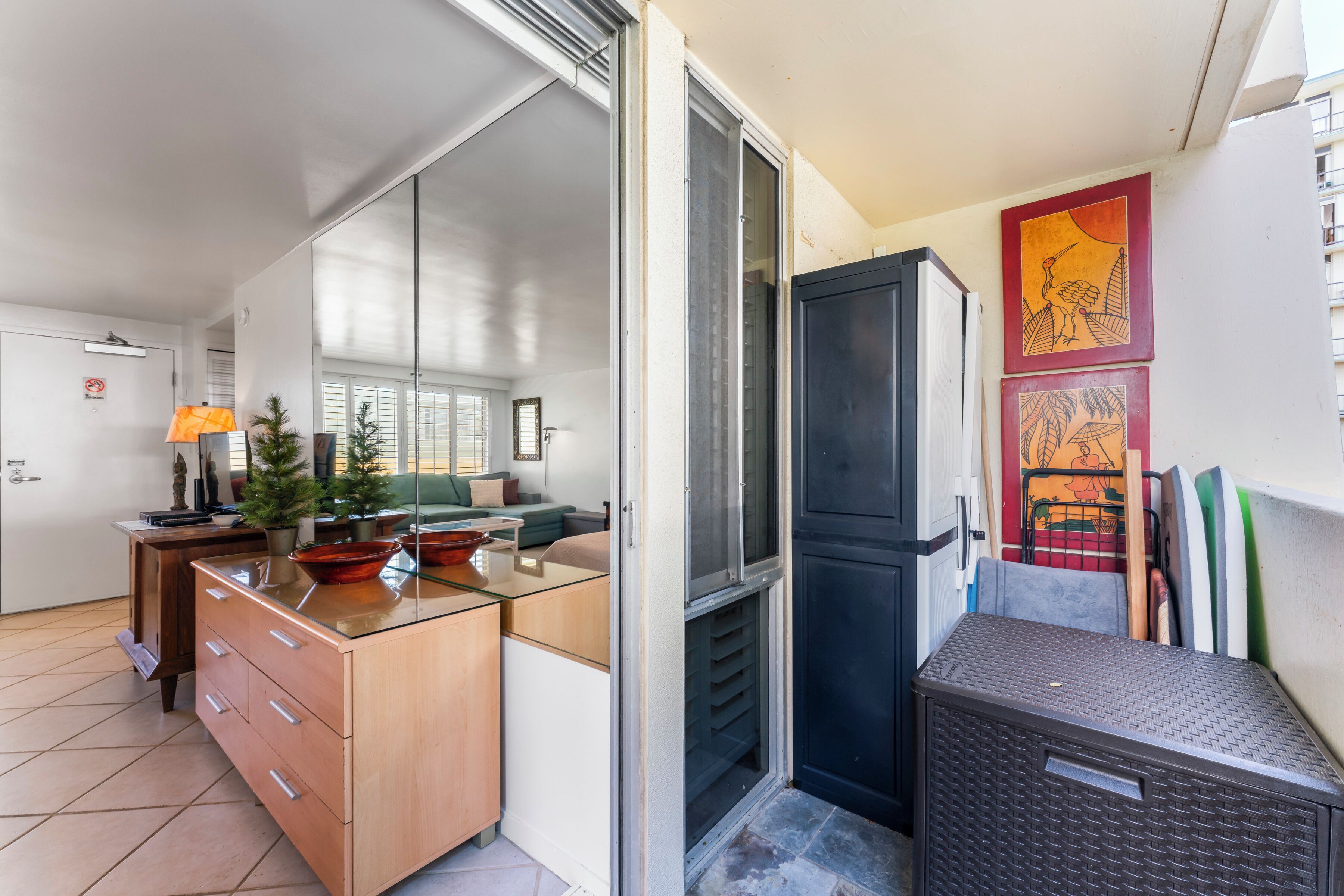A compact living space with a kitchenette, a dining area, and a small seating area.